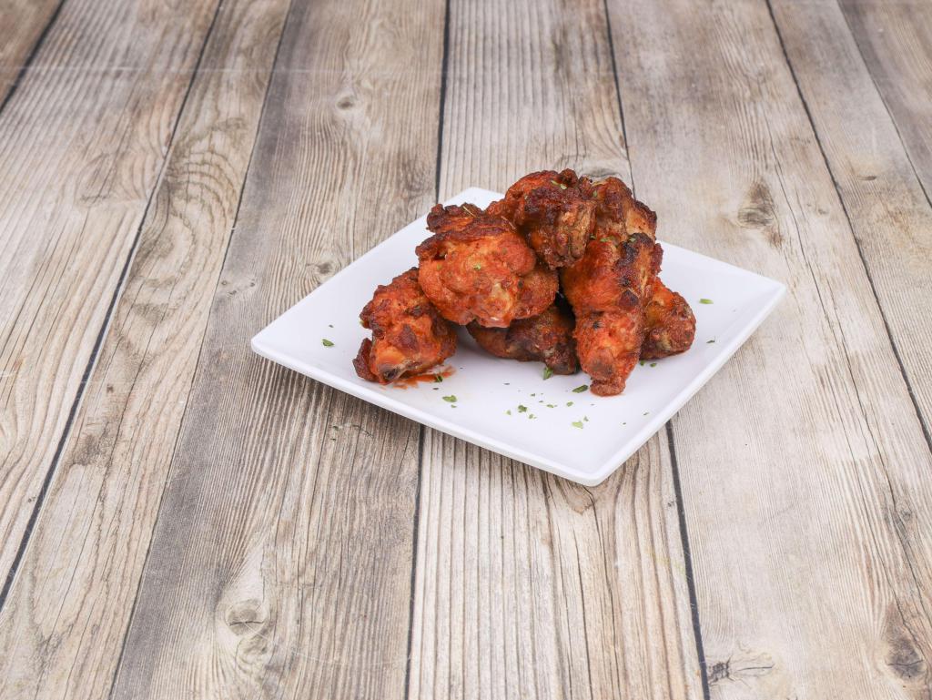 Bone-In Wings · Served with choice of sauce.