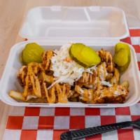 Signature Fries · Hot crispy fries topped with a chopped Nashville style hot chicken tender drizzled. Served w...