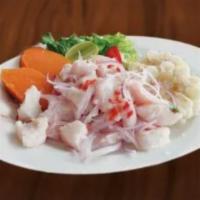 Ceviche Mixto · Seafood and diced fish fillet marinated in lemon sauce served with onions and cassava.