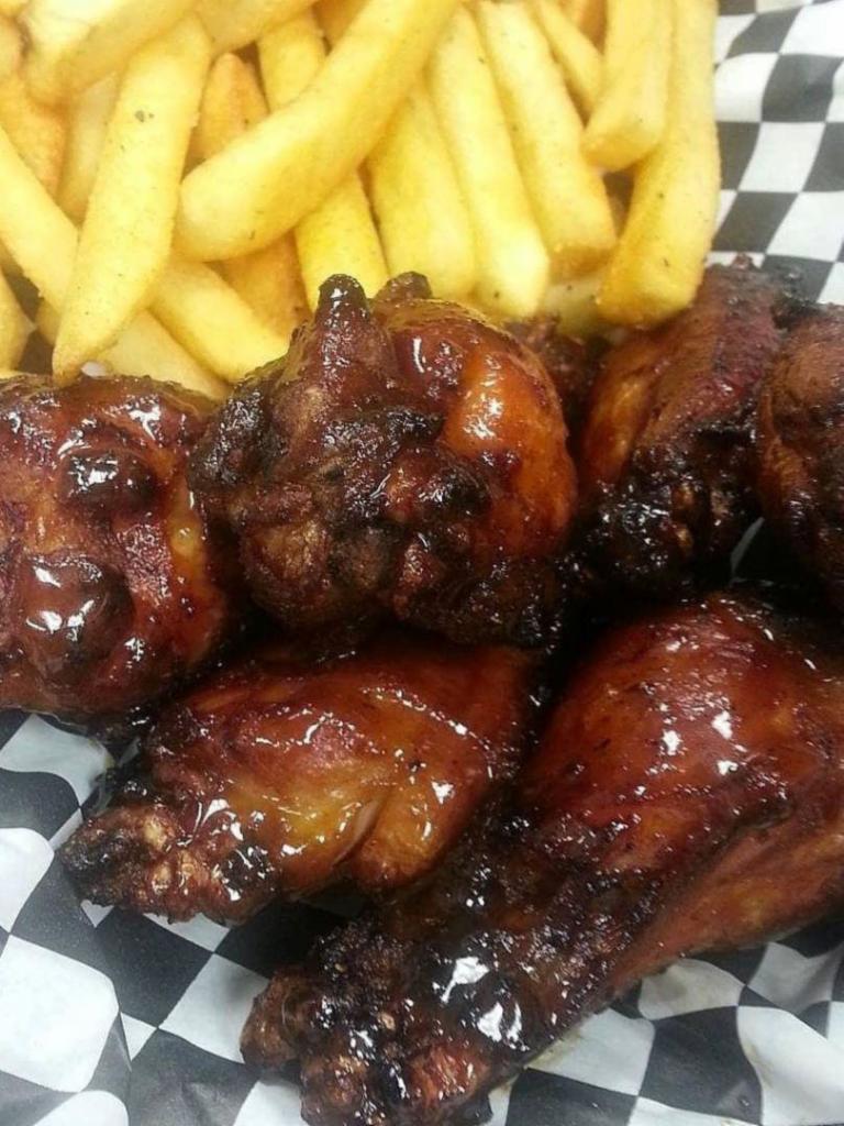 Smoked Wings & Fries · Popular. Wings smoked then fried and tossed to order. Choose from sweet heat, stingin' honey garlic, BBQ Buffalo, or Buffalo sauce.