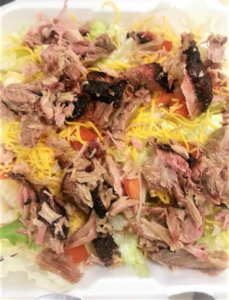 BBQ Salad · Our house salad topped with pulled pork or pulled chicken.