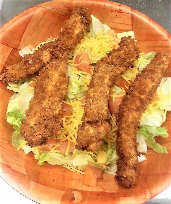 Chicken Tender Salad · Our house salad mix topped with freshly breaded and fried chicken tenders.