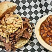 Brisket Sandwich · Our slow-smoked, juicy beef brisket is thinly sliced, served on a toasted bun and topped wit...