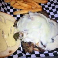 Smokehouse Steak Sandwich · Slow smoked prime rib, thinly sliced then grilled on a bed of onions and bell pepper, then s...