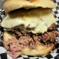 Ty's Cuban Sandwich · 4 oz. pulled pork and four oz. smoked ham with Provolone cheese pickles and our own special ...