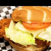 Breaded Chicken Sandwich · Freshly breaded and fried chicken breast served on a toasted bun with tomato and lettuce.