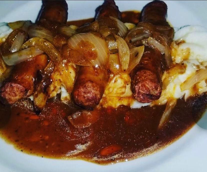 Bangers & Mash  · Imported Irish sausages and mashed potatoes topped with sauteed onions and gravy.