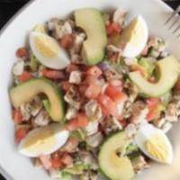 Cobb Salad  · Grilled chicken, bacon, red onion, blue cheese, tomato, avocado, and egg chopped served over...