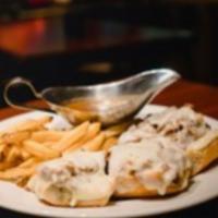 Melting Pot  · Top round sirloin slow roasted and sliced thin, served on garlic bread, melted mozzarella ch...