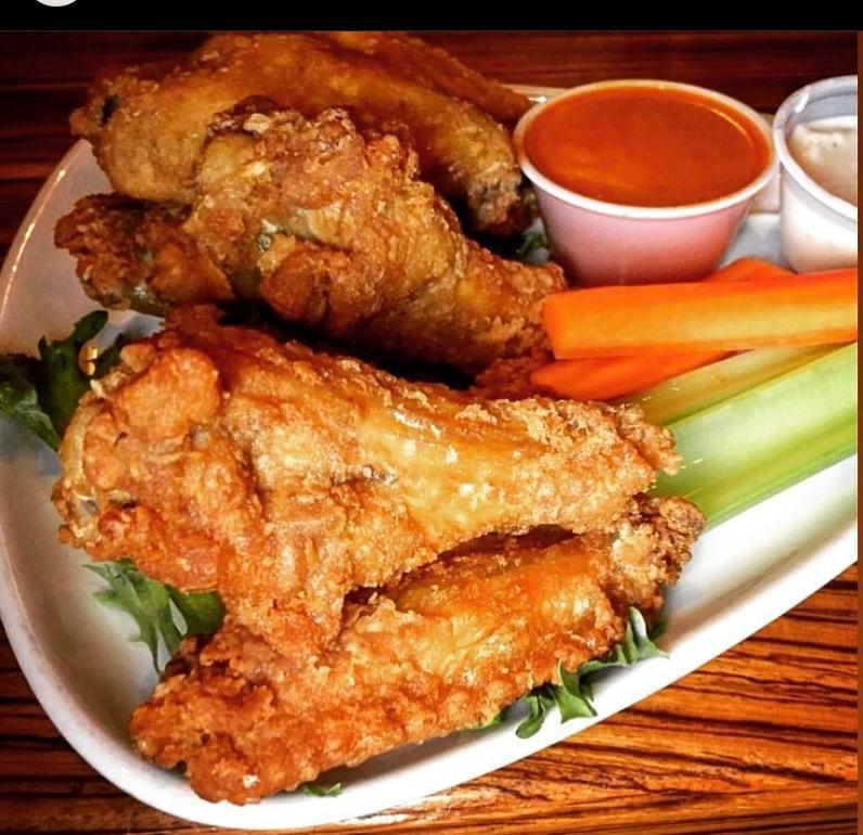 12 Buffalo Wings  · 12 Buffalo Wings.  Choice of Very Hot, Hot, Mild, BBQ, Plain, Parmesan Garlic, or Sweet Chili. Served with Carrots, Celery, & Blue Cheese Dressing  