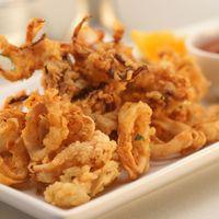 Fried Calamari · Milk Soaked Calamari Dipped in Our Spices & Fried. Served Traditional with Marinara, Buffalo...
