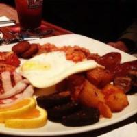 Irish Breakfast  · 2 eggs, Irish bacon, sausage, black and white pudding, baked beans, grilled mushrooms tomato...