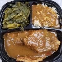 Smothered Turkey Chops over Rice Combo · Smothered turkey chops over rice, served with 2 sides and a roll.
