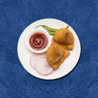 Indian Veggie Empanada · Crispy fried turnover with an amazing filling of spiced potatoes and green peas
