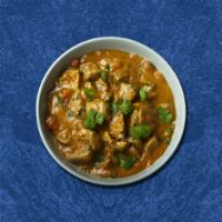 Clubhouse Chicken Curry · Chicken cooked with onion, tomato base sauce mixed with Indian spices
