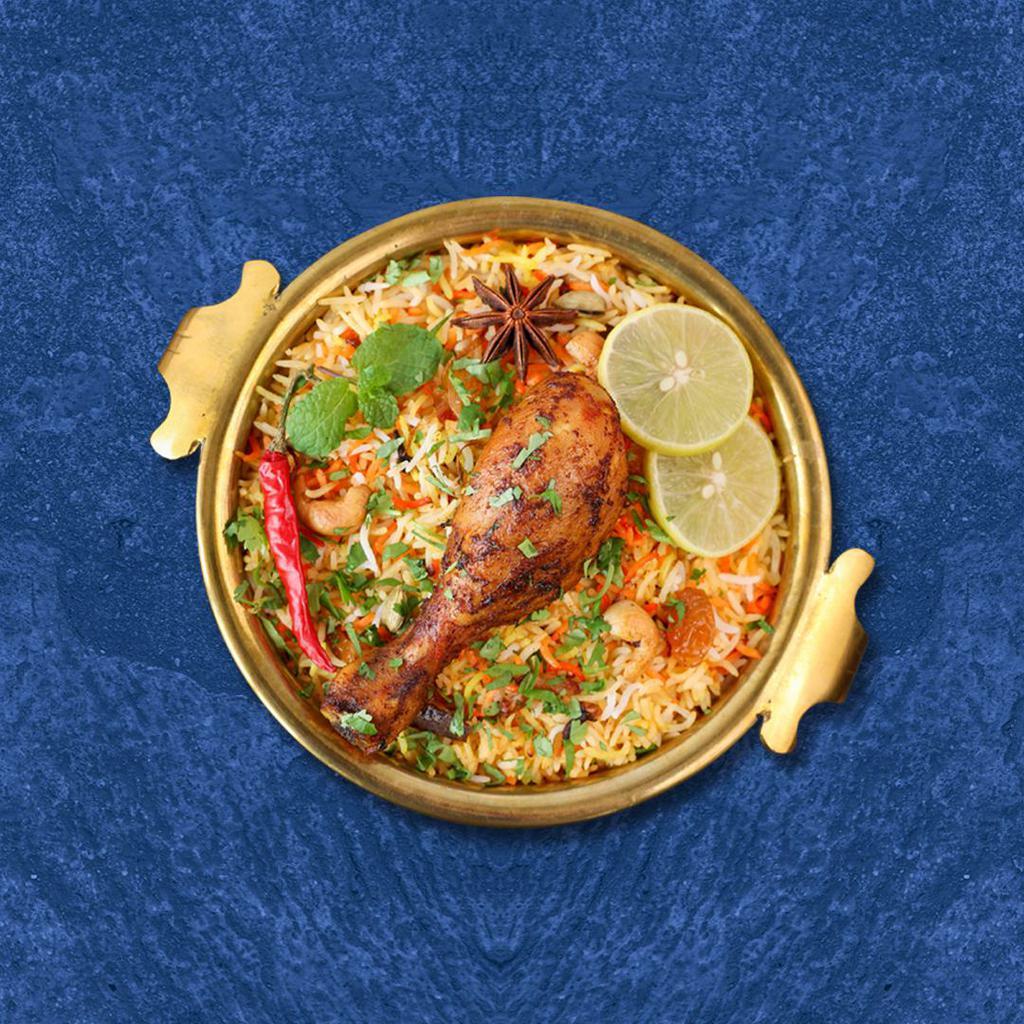 Chicken Bayside Biryani · Marinated chicken and saffron-flavored basmati rice with herbs and spices, garnished with raisins and cashews
