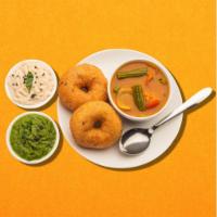 Dipped Fritter Doughnuts · Deep fried savory donuts  served with rasam , a tangy tomato and classic coconut dipping sau...
