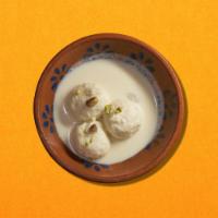 Rasmalai · Soft cheese patties soaked in milk, cardamom and rose water syrup.
