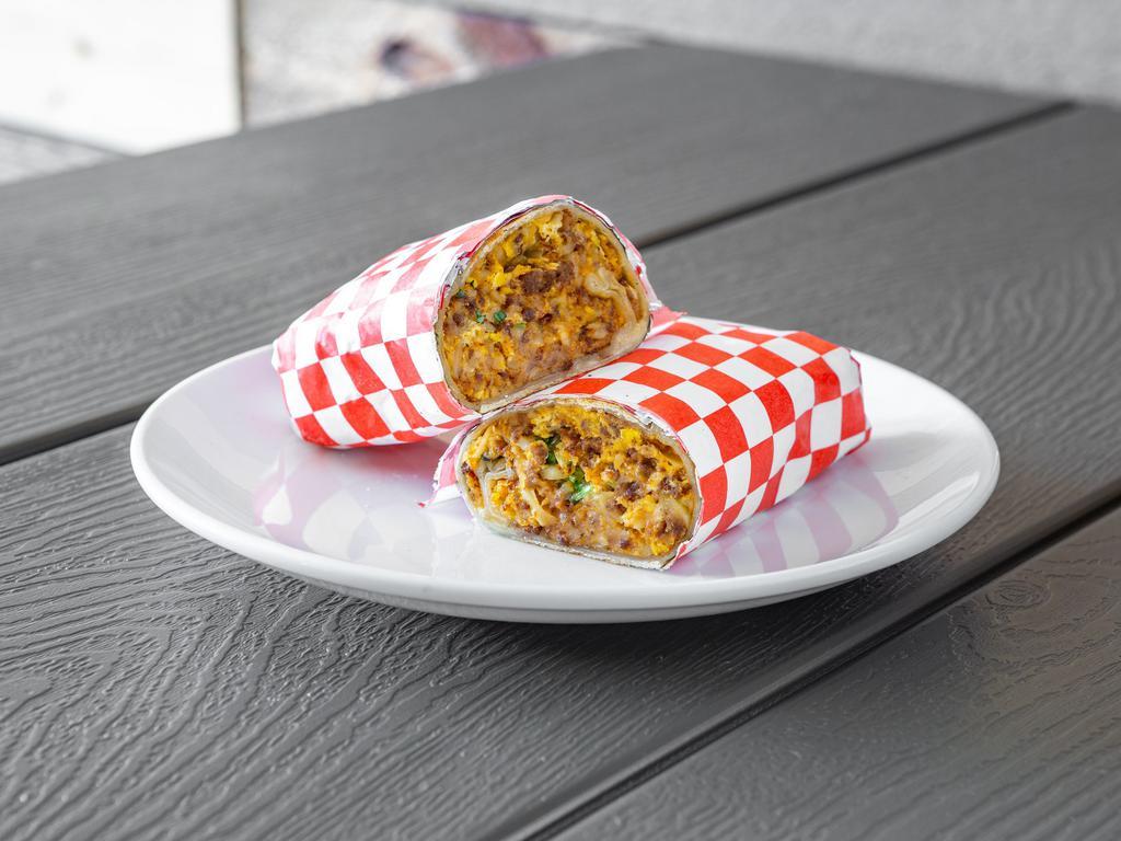 #1 - Breakfast Burrito  · The always popular burrito that consists of a flour tortilla filled with eggs, tasty diced potatoes, onions, tomatoes, fresh cilantro, homemade salsa, and your choice of filling! Ohh and cheese!!