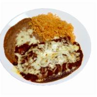 #2 - 2 Enchilada Plate · One of Mexico's original dishes! Corn tortillas with your choice of filling, covered with en...