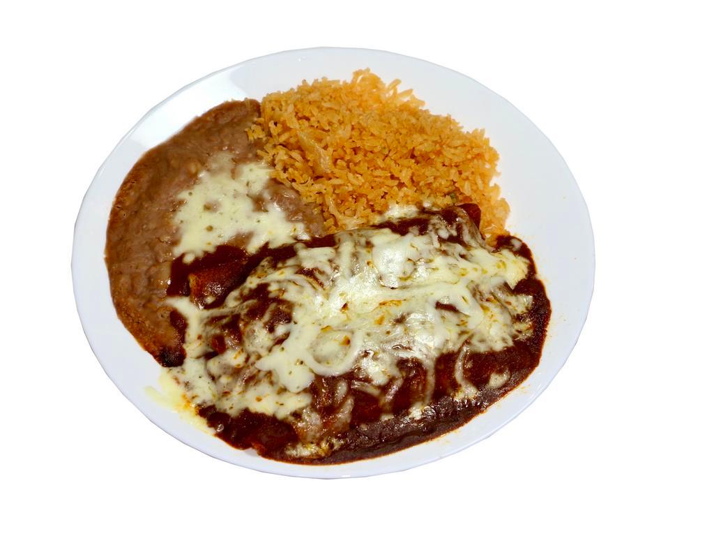 #2 - 2 Enchilada Plate · One of Mexico's original dishes! Corn tortillas with your choice of filling, covered with enchilada sauce, served with rice and beans on the side, melted cheese, a serrano pepper on the side, and a refreshing canned soda.