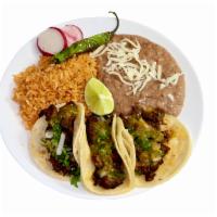 #3 - 3 Tacos Plate · The famous street tacos! Corn tortillas with your choice of filling, including onions, and f...