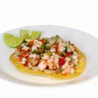 #12 - Ceviche Tostada · Tostada with Shrimp, Onions, Tomatoes, Cilantro, Carrots, served with Lime on the side.