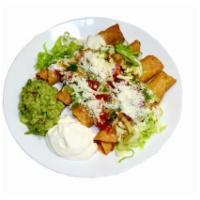 #19 - 4 Taquitos  · Corn Tortilla, Filled with Chicken, Potato and Cheese, Topped with Lettuce, Tomatoes, Salsa,...
