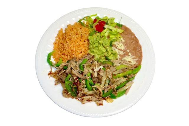 #25 - Pork Carnitas · Pork Carnitas served with Onions, Bell Peppers, Rice, Beans, Cheese, Lettuce, Tomatoes and Guacamole. Serrano Pepper and corn tortillas on the side.