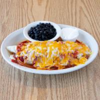 Breakfast Burrito · Eggs, sausage, hash browns and cheese wrapped in a warm tortilla, topped with melted cheddar...