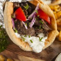 Lamb Gyro Sandwich · Cooked on a spit and wrapped in a pita. 