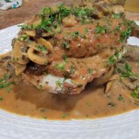 Pork Chop alla Giovanni · Stuffed Pork Chop with Ricotta Cheese and Spinach topped in a Mushrooms Sauce Served with Ro...