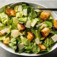 Caesar Salad · Crisp hearts of romaine tossed in robust Caesar dressing, topped with herbed croutons and Pa...
