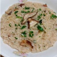 Risotto ai funghi Porcini · Italian Arborio rice sauteed with fresh Porcini mushrooms and truffle oil