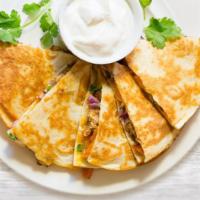 Chicken or Beef Quesadilla · Chicken or Beef, Green Pepper, Onion, Mozzarella & Cheddar Cheese in a flour tortilla and 1 ...