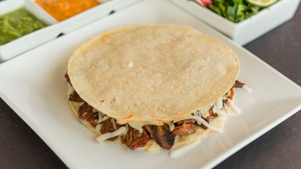 Mulita · Double corn tortilla, cheese and meat.