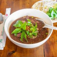 5. Pho Beef Noodle · Sliced beef, bean sprouts in beef broth soup topped with onions, cilantro and garlic oil. Ad...