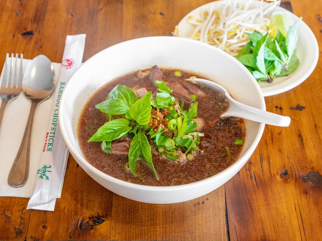 6. Combination Beef Noodle Soup · Sliced beef, meatballs, beef liver, bean sprouts in thick beef blood broth topped with onions, cilantro and garlic oil. Add pork skin for an additional charge.