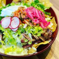  Nachos · Choice of up to any 2 meats topped with, cheese, lettuce, pico de gallo, jalapeno, sour crea...