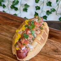 Sonora Dog · 1/4 lb. all-beef hot dog wrapped in bacon topped with onions, tomatoes, jalapenos topped wit...