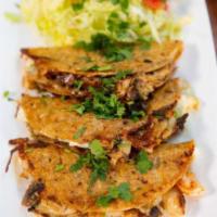 Taquitos Fritos · 4 fried taquitos with your choice of shredded chicken or barbacoa. Served with lettuce, toma...