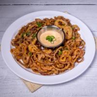 Onion Strings · Fine cut red onions, fried golden brown, and served with our house-made Russian dressing.