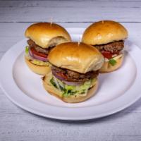 Social House Beef Sliders · Served with lettuce, tomato, garlic aioli and red onion slices.