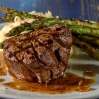 Peppercorn Center Cut Filet · Served with grilled asparagus, roasted garlic mashed potatoes and a port wine demi glaze.