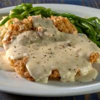 Dry Aged Chicken Fried Steak · 21-day aged cutlet served with roasted garlic mashed potatoes, green beans and peppered gravy.