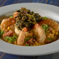 Shrimp and Grits · Jumbo Gulf Coast shrimp sauteed in our Tabasco sauce served with creamy andouille sausage gr...