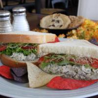 Cafe Chicken Salad Sandwich · Freshly-made chicken salad, lettuce, tomato, sunflower seeds, mayo and sprouts. Served with ...
