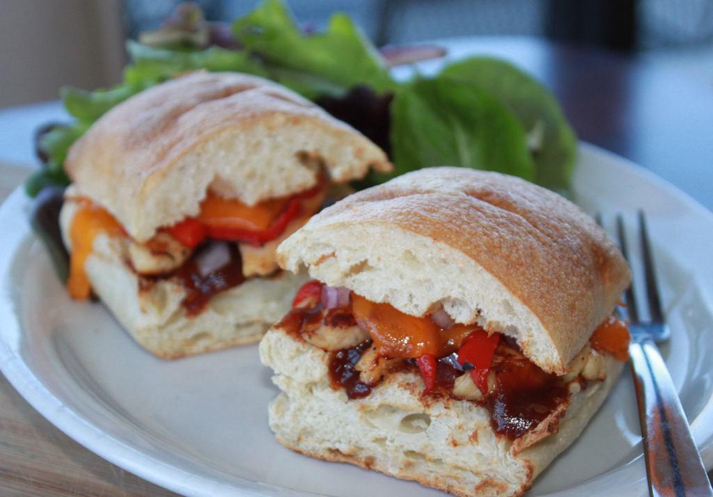 BBQ Chicken Chipotle · Ciabatta bread, grilled chicken, chipotle bbq sauce, roasted red peppers, red onions and cheddar cheese. Served with choice of side.