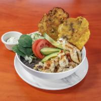 Grilled Chicken Tender Bowl · Includes rice, black beans, avocado, cheese, lettuce, tomato, two tostones, and house's sauce.