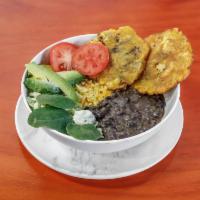 Veggie Bowl · Includes rice, black beans, avocado, cheese, lettuce, tomato, two tostones, and house's sauce.